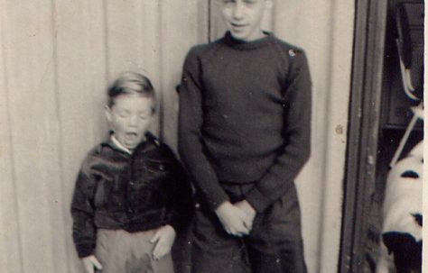 Nick and his brother outside the prefab, Roding Avenue, Barking