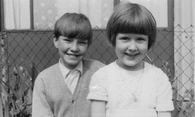 Nick Dowsett and cousin with No. 12 Roding Avenue, Barking in the background | Nick Dowsett