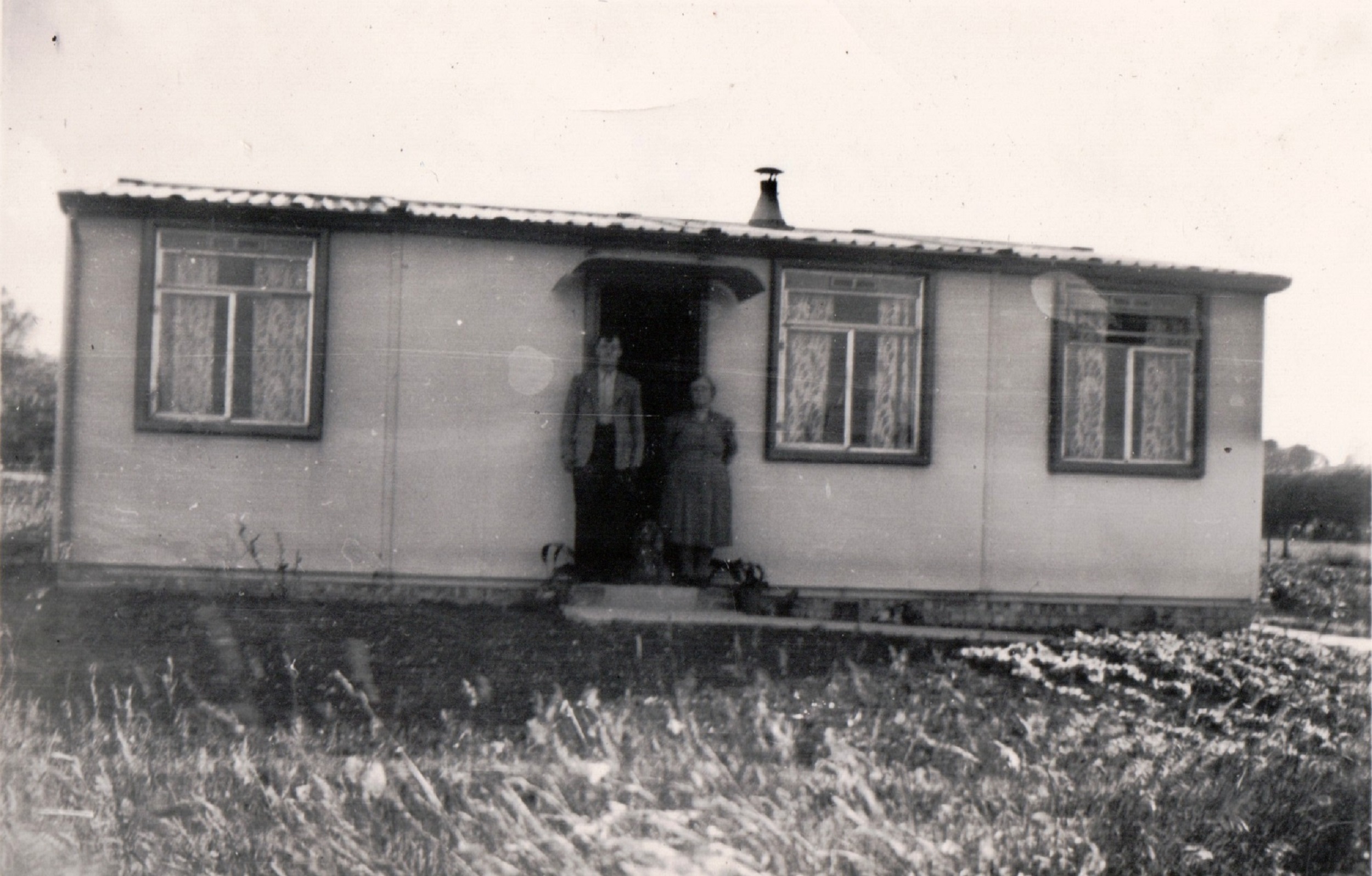 Albert and Winifred Arnold outside their prefab. 13 Mill Close, Ringmer