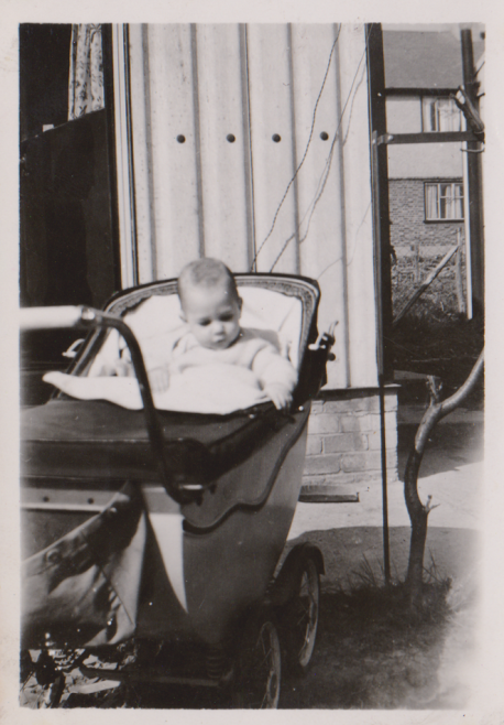 Me in pram beside back door late 1940s | Pete Hicks