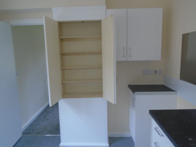 Rebuilt kitchen cupboard, Wake Green Road prefab | Prefab Museum